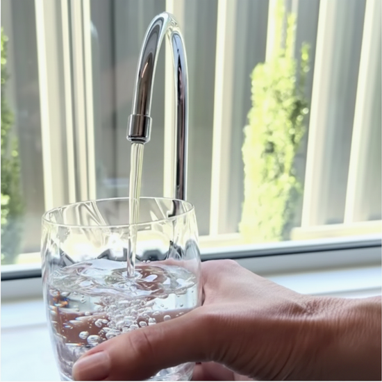 Cellfood Original Concentrate — filling a glass of fresh water from a tap